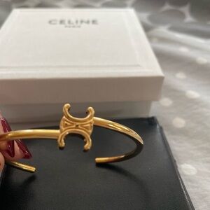 Brand new Celine bracelet in gold